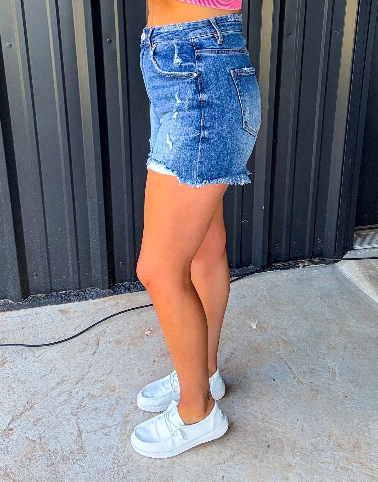 The Bailey Risen High Rise Distressed Denim Shorts